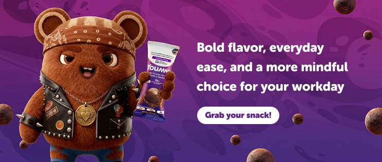Choko holding a Yoummy chocolate snack for a more mindful office routine